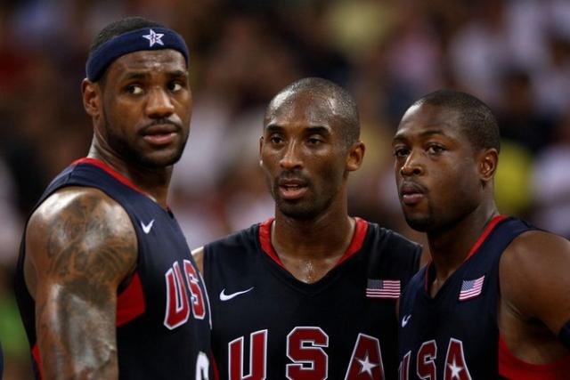 Kobe Bryant is flanked by LeBron James and Dwayne Wade of Team USA