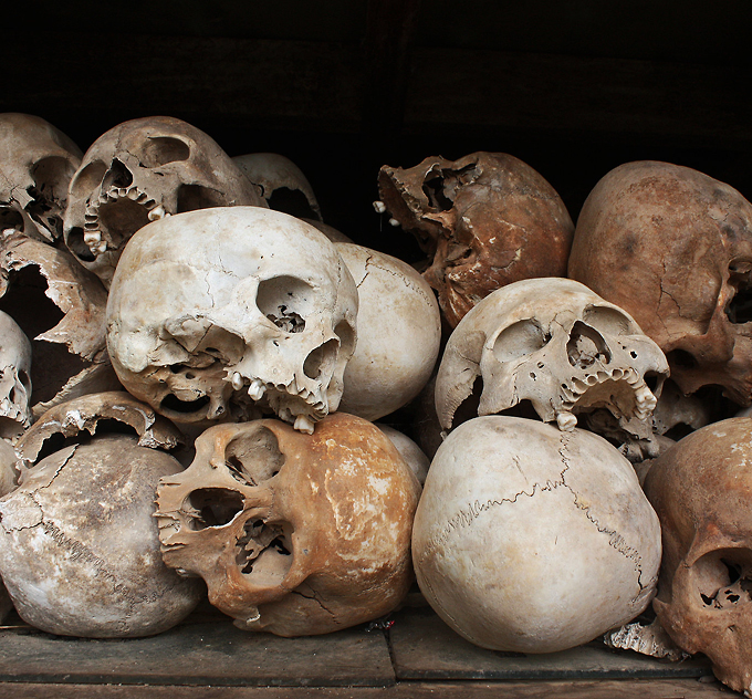 Skulls of the victims of the Khmer Rouge occupation of Cambodia in the memorial stupa at the Choeung Ek Killing Field Phnom Penh Cambodia istolethetv CC