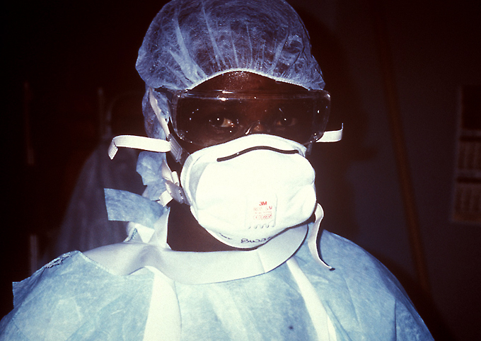 This 1995 photograph shows a nurse with personal protective equipment PPE prepared to enter the Ebola VHF isolation ward during Ebola virus disease outbreak in Zaire 1995