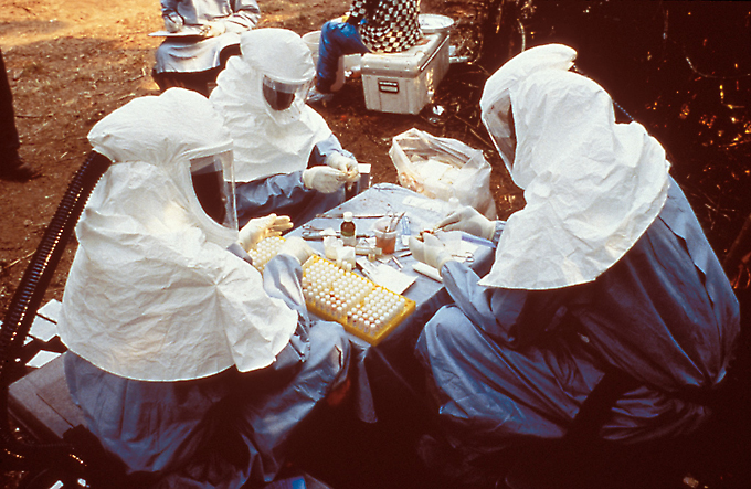 cientists wearing personal protective equipment (PPE) testing samples for the Ebola virus from animals collected in Zaire ~ 1995 -  Public Health Image Library