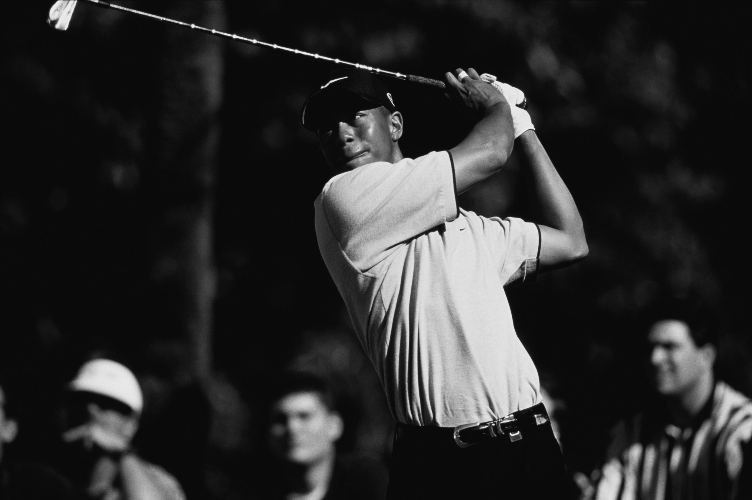 1998, Miami, Florida, USA --- Professional golfer Tiger Woods swings his golf club during the 1998 Doral Open. --- Image by © Duomo/CORBIS