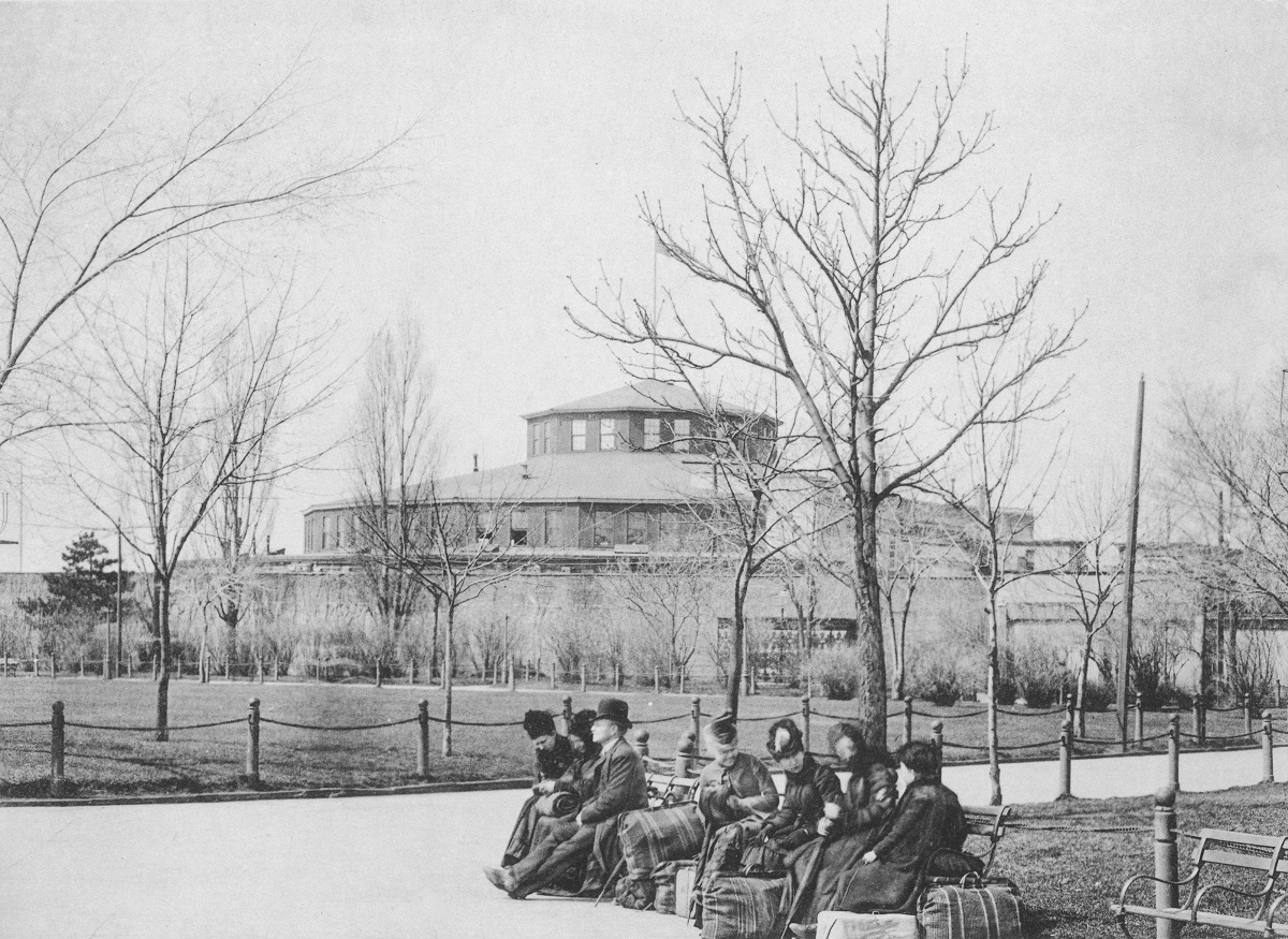 Immigrants sit on benches with their luggage at Castle Garden, the island used for processing immigrants between 1855 and 1890 prior to the development of Ellis Island, New York City, 1880s. (Photo by Hulton Archive/Getty Images)