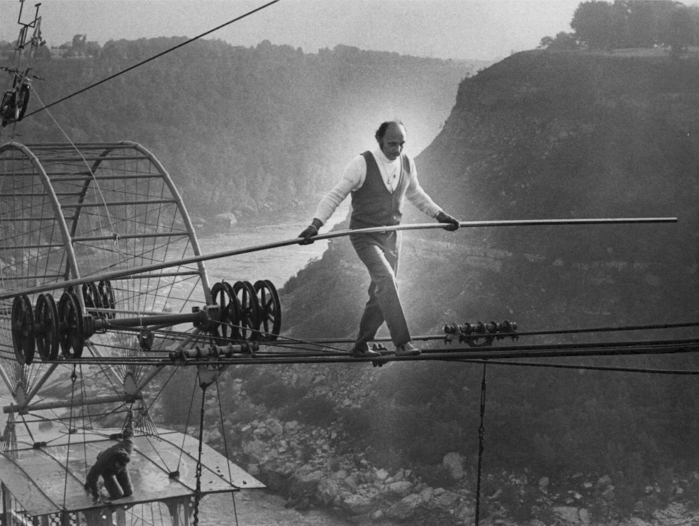 e Henri Rechatin walking a tight rope on the wires of the Spanish Aero Car Niagara Falls, 1975