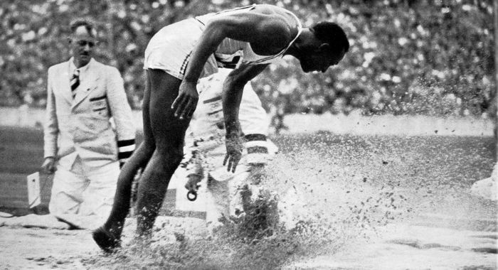 Jesse Owens winning the broad jump Olympic Games Berlin 1936