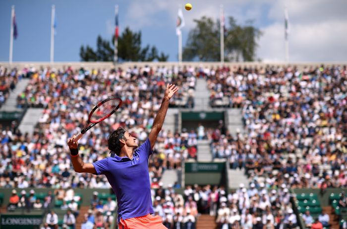 Roger Federer in action during his Second round men's singles match against Marcel Granollers on day four of the French Open at Roland Garros on May 27, 2015 in Paris, France