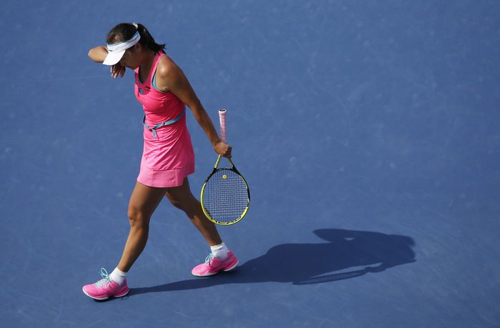 Image #: 31758194 Shuai Peng from China wipes her head in the first set of her match against Caroline Wozniacki of Denmark in the semi-finals at the US Open Tennis Championships at the USTA Billie Jean King National Tennis Center in New York City on September 5, 2014. UPI/John Angelillo /LANDOV