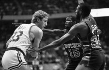 Celtics' Larry Bird is double-teamed by Milwaukee Bucks Craig Hodges (150 and Paul Pressey as Bird tries to pass ball off during 1st quarter action of the game at Boston Garden, 12/19