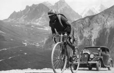 ca. 1935 --- Original caption: Here the Spanish bicycle racer Truerbach is climbing an Alpine road during the Tour de France. --- Image by © Underwood & Underwood/Corbis