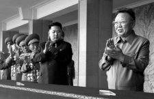 Image #: 12166438    (101010) -- PYONGYANG, Oct. 10, 2010 (Xinhua) -- Kim Jong Il (1st R), top leader of the Democratic People's Republic of Korea (DPRK), and Kim Jong Un (2nd R), vice-chairman of the Central Military Commission of the Workers' Party of Korea (WPK), applaud before a grand military parade to celebrate the 65th anniversary of the founding of the WPK, in Pyongyang, Oct. 10, 2010.       Xinhua /Landov