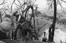 VIETNAM WAR: LAOTIAN BORDER. 
A U.S. Marine throws a hand grenade into a Viet Cong spiderhole during a battle near the Laotian border, May 1967.