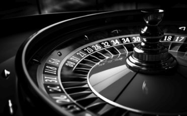casino roule wheel in dark, in the style of dynamic composition,