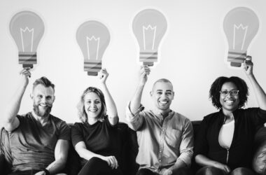 people carrying light bulb icons